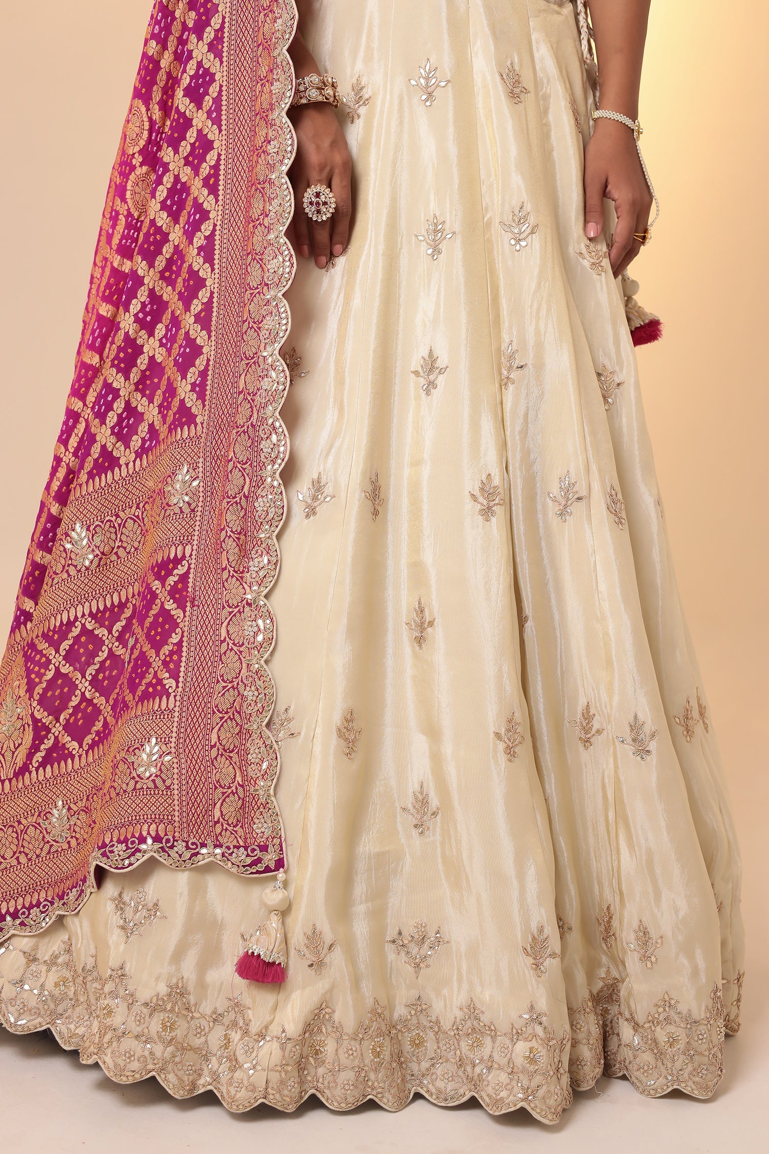 Tissue Lehenga with Bandhej duppatta.