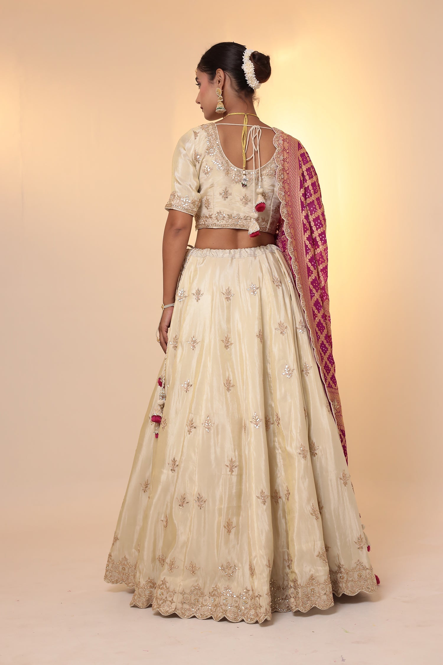 Tissue Lehenga with Bandhej duppatta.